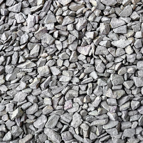 driveway gravel provides natural drainage, a rustic appearance, and is easier to maintain compared to other materials